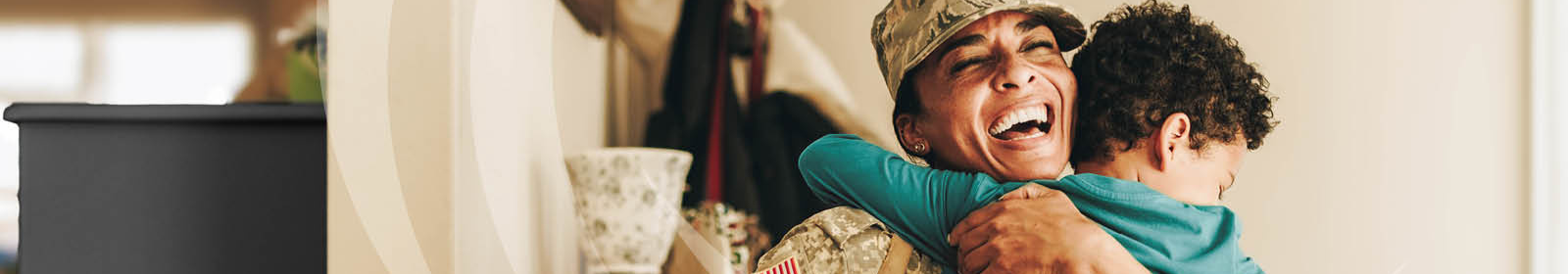 veteran hugging child.